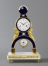 An attractive French Empire enamel mounted and ormolu mantel clock by Gaston Jolly, circa 1800, height 55cm.